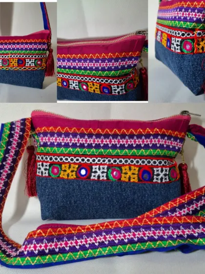 Here is a colorful sling bag made from a combination of denim and vibrant, traditional embroidered fabric. This is a perfect example of how I can merge different materials to create a standout accessory.