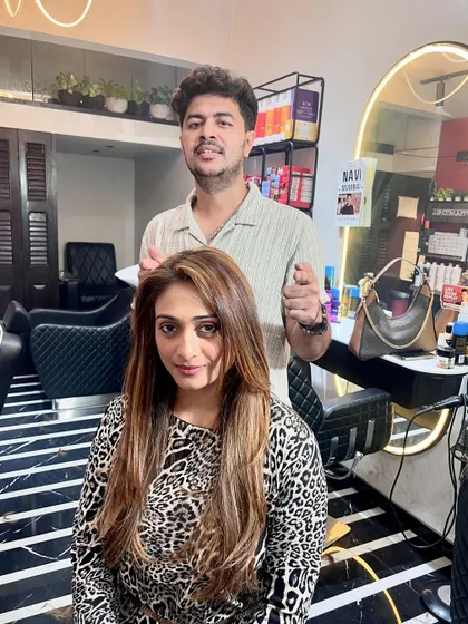 Here I am with the client after her transformation. A successful color service is all about collaboration and ensuring the final look matches the client's personality and style.