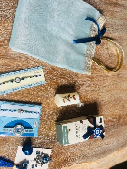 A different layout of the evil-eye themed Rakhi gifts, showing the versatility in arrangement.