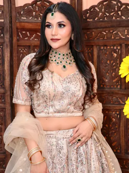 A full portrait showcasing the emerald green American Diamond necklace set. This is a great option for adding a pop of colour to a neutral-toned outfit.