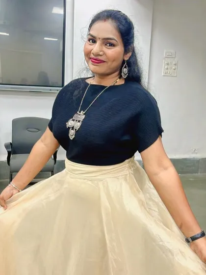 A happy client showing off her simple yet elegant Navratri outfit.