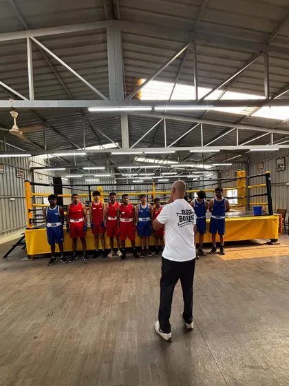 I address the young fighters before the intra-gym tournament begins. These events are crucial for building experience and team spirit.