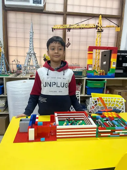 This student created a LEGO model of a soccer field, complete with a goal. Our workshops allow kids to build projects based on their own interests.