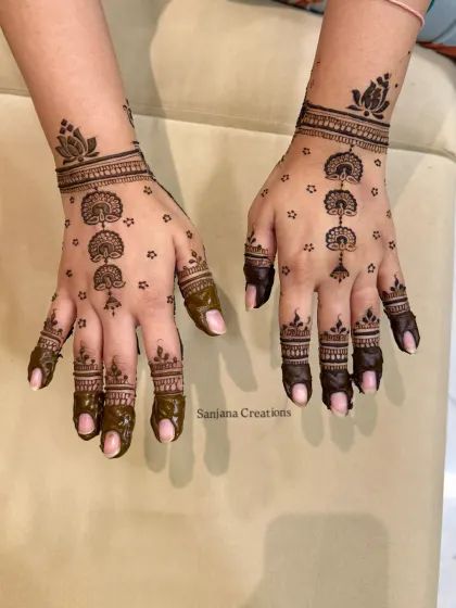 A simple and elegant 'booti' design for Karwachauth, perfect for someone who wants a minimalist look.