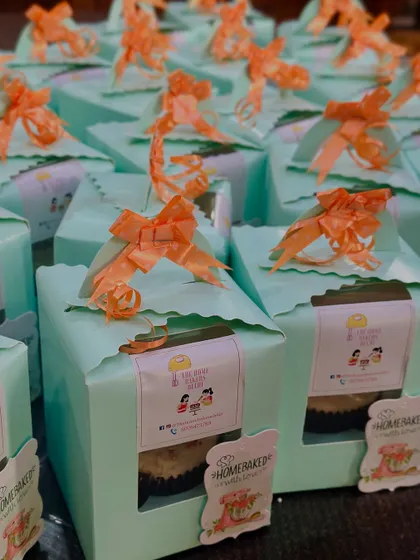 A large corporate order of our vanilla buttercream cupcakes. Each cupcake is individually boxed with our branding, making them perfect for office farewells, celebrations, or client gifts.