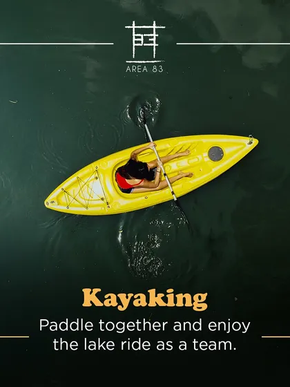 Paddle together and enjoy the lake ride as a team. This aerial shot shows a solo kayaker enjoying the calm water.