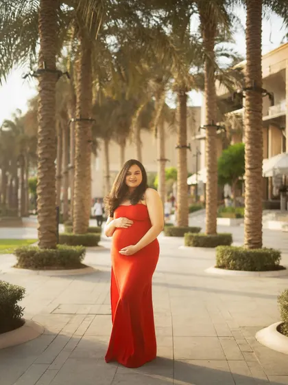 For this shot, we swapped the dramatic tulle gown for a sleek, bodycon red dress. It shows how a simple change of outfit can create a completely different, more modern vibe in the same beautiful outdoor location.