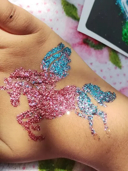 Unicorns are always a favorite. This magical winged unicorn, or Pegasus, is created with a beautiful blend of pink and blue glitter, making it a dream come true for any unicorn-themed birthday party.