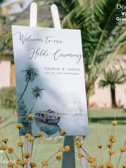 A welcome that is also a piece of art. This greetboard for a Haldi ceremony in the Kerala backwaters features a beautiful painting inspired by the local scenery, setting a serene and artistic tone for the event.