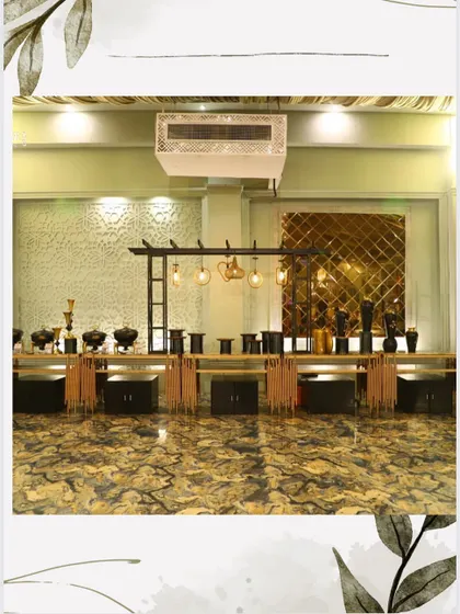 A wide shot of one of our elegant indoor buffet setups, showing how our counters integrate seamlessly into the overall venue decor.