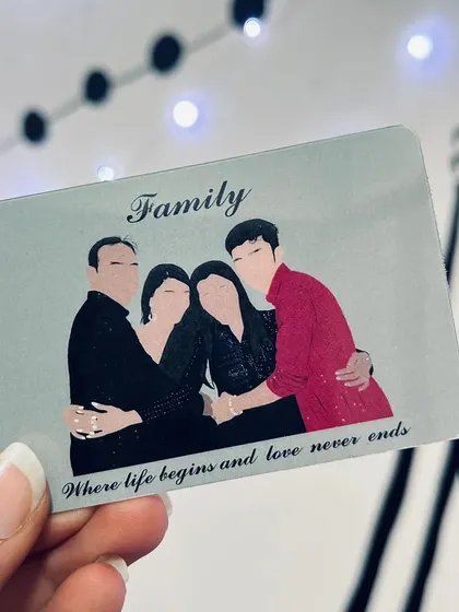 A custom wallet card featuring a faceless illustration of a family, with the quote "Family, where life begins and love never ends." It's a small, meaningful keepsake to carry with you.