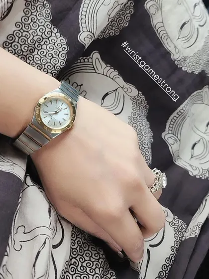 A classic dual-tone Omega watch is more than an accessory; it's a power piece. It's my go-to for meetings, adding a touch of timeless class to any outfit.