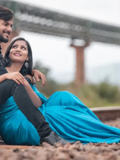 A romantic pre-wedding photo set on railway tracks. We find beauty in unconventional locations, creating a unique and memorable setting for this couple's story.