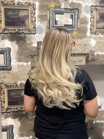 A long, flowing blonde transformation that is pure hair goals.