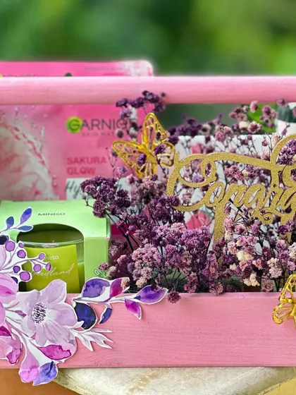 This shot highlights the "Congratulations" topper and the curated items inside the pink grooming hamper. It's a thoughtful gift to celebrate a promotion, graduation, or any personal achievement.