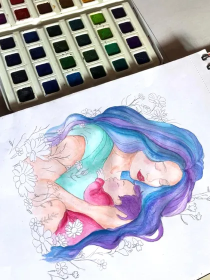 Here is a look at the mother and child illustration in progress. I start with light watercolor layers and build up the colors to create a soft, dreamy effect.