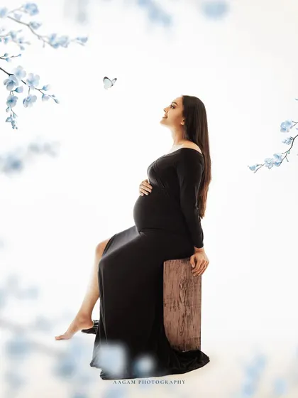 A touch of magic with a butterfly, symbolizing transformation and the beautiful new beginning of motherhood.