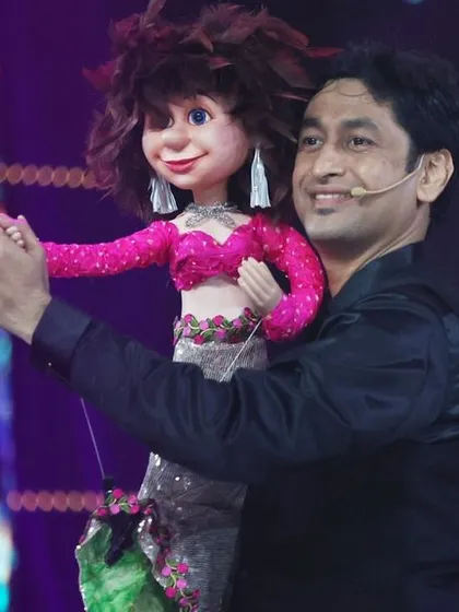 Dancing with my puppet, a moment of pure joy and connection that I love to share with the audience.