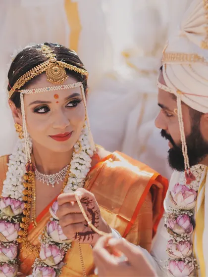 A quiet glance during a South Indian wedding ceremony. It's these unscripted, in-between moments that often tell the most powerful stories, reflecting a deep connection amidst the traditional rituals.