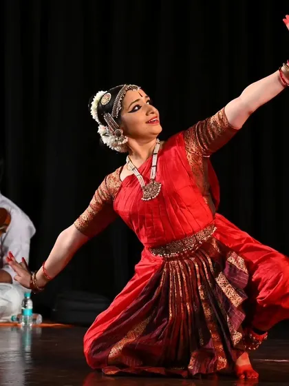 Meera Sreenarayanan performing with the live orchestra in the background. The interplay between dancer and musician is key to a great performance.