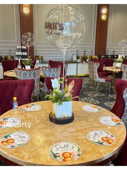 Another view of the elegant jungle-themed table settings in the main dining hall.
