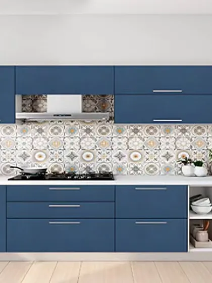 This straight kitchen design features bold blue cabinets and a vibrant, decorative tile backsplash. We included open shelving at the end of the counter for easy access to frequently used bowls and spices.
