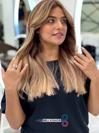 The client showing off her new creamy peach ash blonde hair. The color is playful, stylish, and full of personality.