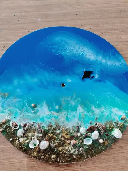 A beautiful final result from our resin art class, showcasing the unique patterns that can be created with this medium.