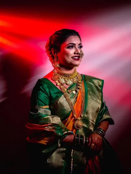 Another artistic portrait of the bride, using beams of red and white light to create a dynamic and visually interesting background.