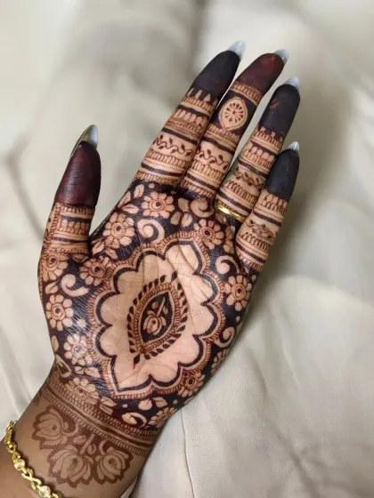 Another look at the detailed paisley and floral cutwork design, a perfect choice for a glamorous party look.