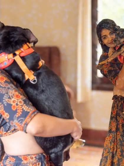 The reflection in the mirror adds a vintage, storybook feel to this moment of a pet parent holding her dog. I love finding creative ways to tell your family's story.