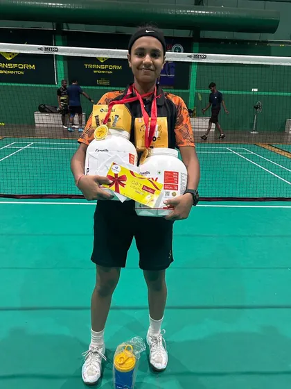 Our player Sneha with her prizes after winning both the U-19 and Women's Singles titles at the Summer Badminton Challenge. Her dual victory is a result of relentless practice and dedication.
