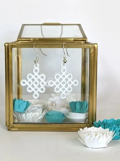 The same Kolam-inspired earrings, this time printed in white. We can produce our designs in a variety of colors to match your style. These are lightweight and make a unique statement.