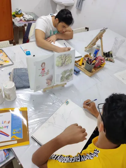A wider view of our studio shows students working on their individual projects, including this tree study, fostering a collaborative and focused learning environment.