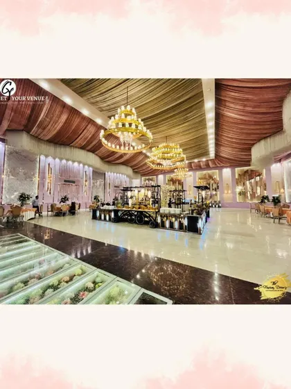 A grand view of our catering setup in a large banquet hall. The scale of our operation is matched by our attention to detail.
