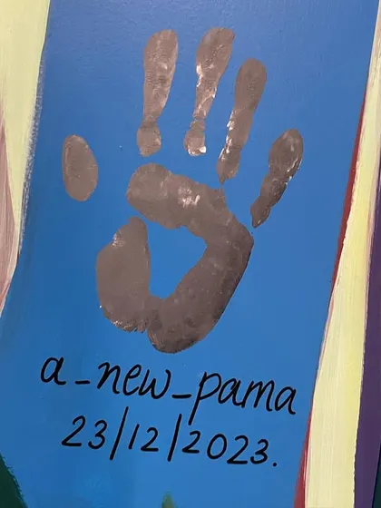 My signature handprint, marking the completion of the mural for The Gender Lab. It's a small sign that I was there, leaving a piece of my story on the wall.