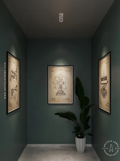 In this narrow gallery space, our architectural ceiling lights are precisely aimed to spotlight each piece of art. This creates individual focus on each frame while maintaining a moody, sophisticated atmosphere in the room.