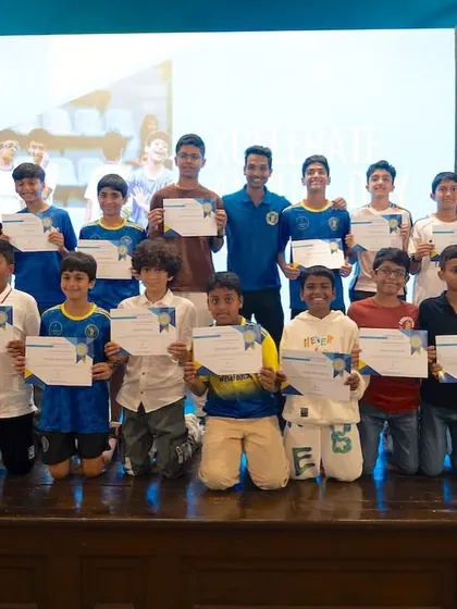 The U13 and U15 players from our Xcelerate program pose for a group photo on stage with their certificates. This is a moment to recognize the progress and dedication of our youth teams.