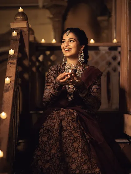 Another shot from our Deepawali campaign, filled with the warm glow of candles. Her joyful expression and radiant makeup capture the spirit of the festival.