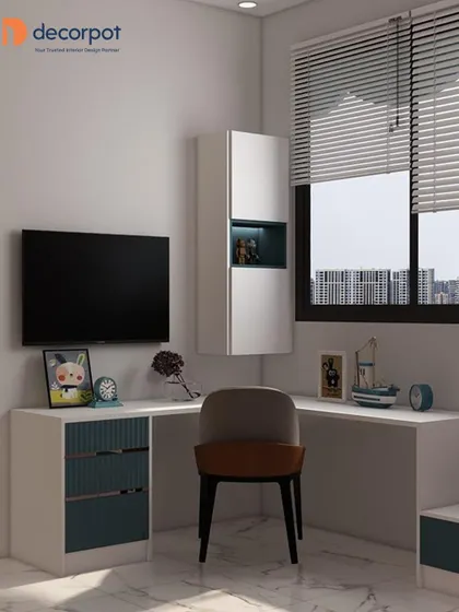 An L-shaped study desk designed to fit perfectly in a corner by the window. The combination of white and teal fluted drawers adds a pop of color and texture to this bright workspace.