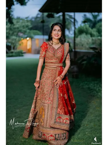 The bride looking radiant and happy in her reception attire.