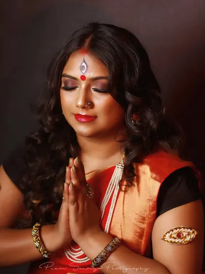 A serene and graceful moment captured during our creative shoot. The eyes are closed, showing off the blended eyeshadow and liner, while the skin maintains a soft, luminous glow under the studio lights.