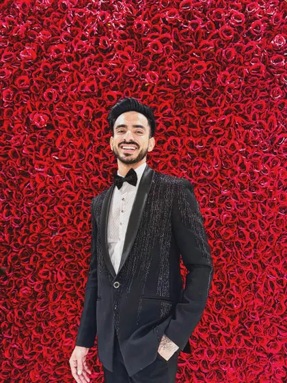 This is my katdana-shower work tuxedo, a modern classic for any formal event. The subtle shimmer of the beadwork on the jacket catches the light, creating a sophisticated and textured look that stands out from a standard black tux.