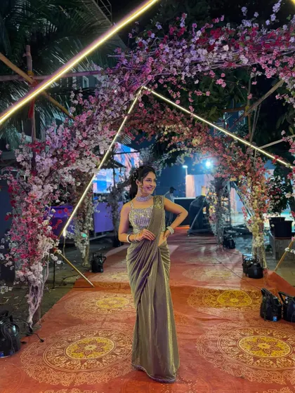 If you want elegance without the effort, I suggest my ready-to-wear sarees. This green shimmer saree comes pre-draped with a stunning sequined blouse, making it a perfect, hassle-free option for wedding guests or parties.