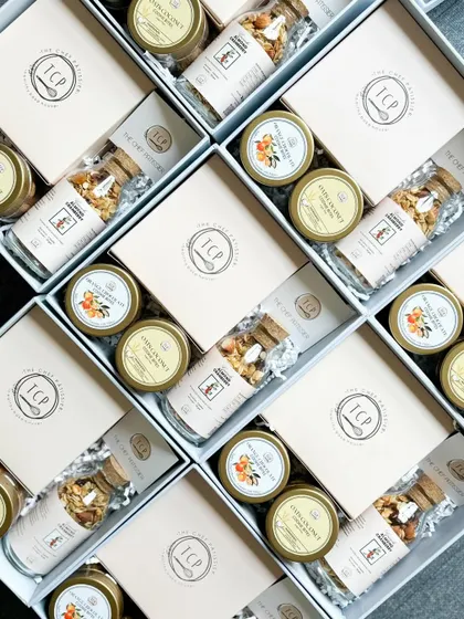 We offer full customization for our corporate gift hampers. These boxes were curated with a specific selection of granola, cookies, and cakes as per the client's request.