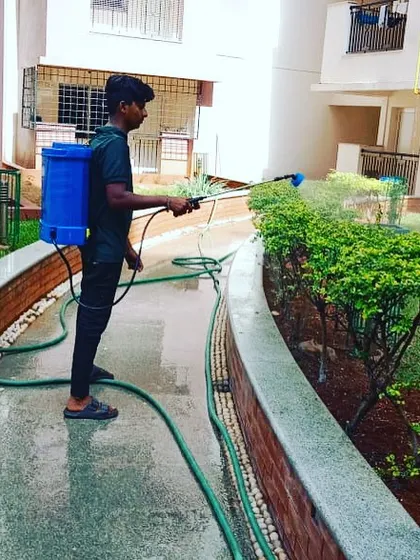 At another residential complex, our team provides regular maintenance, including spraying for pests. We work carefully along pathways to ensure all plants receive the care they need without disrupting the area.