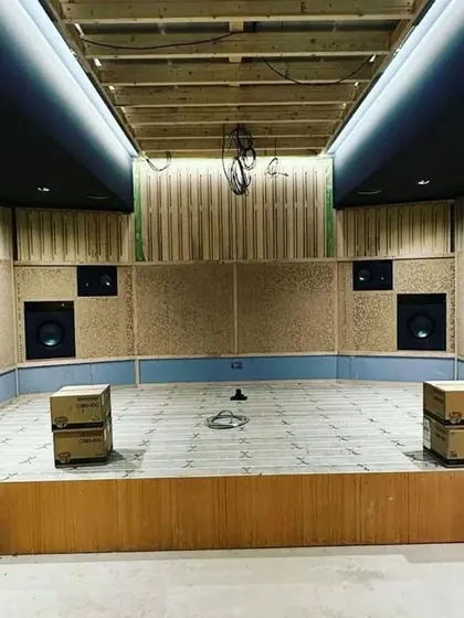 This image shows the "sound cage" or the internal acoustic shell being built. You can see the wooden framework and the installation of sound-absorbing materials.