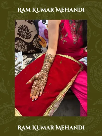 A beautiful bridal arm design with a focus on elephant motifs and detailed patterns, showing the rich texture of the natural henna.
