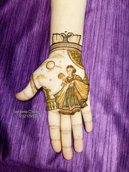 A full view of the hand with the Karwachauth figure, showcasing the complete design.