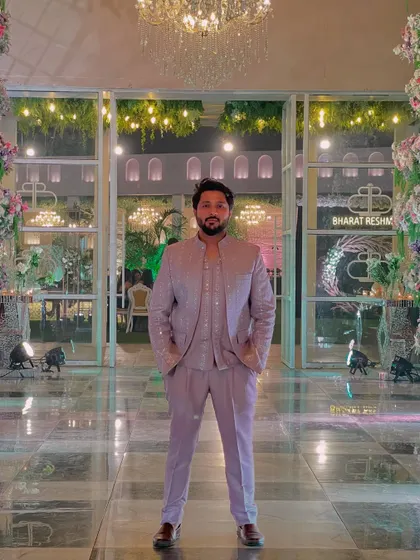 Standing tall and ready to perform. The grand entrance of the venue complements the outfit perfectly.